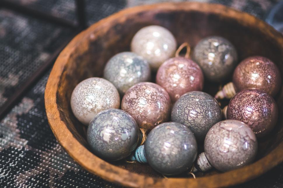 Free Image of Wooden Bowl Filled With Silver and Silver Ornaments 