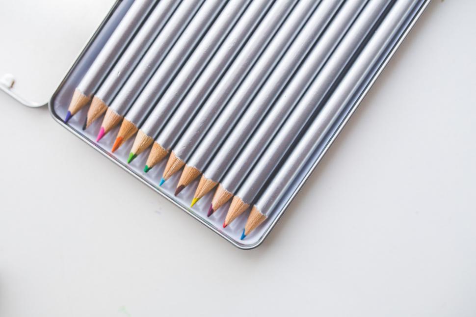 Free Image of Group of Pencils on Top of Metal Container 