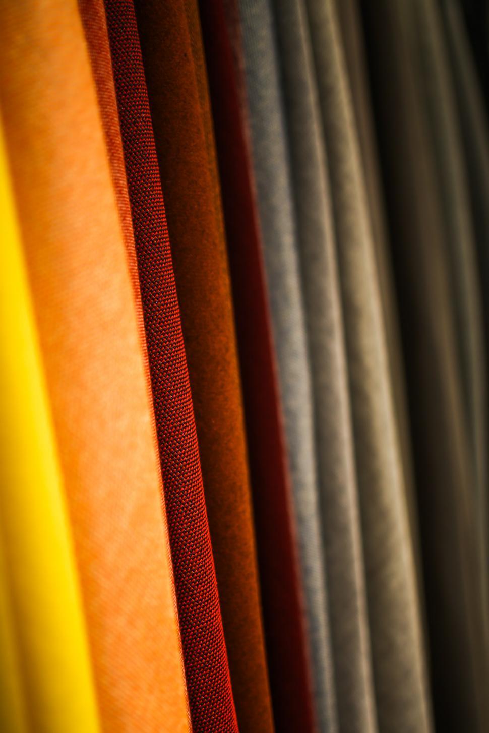 Free Image of Close Up of a Row of Different Colored Fabrics 