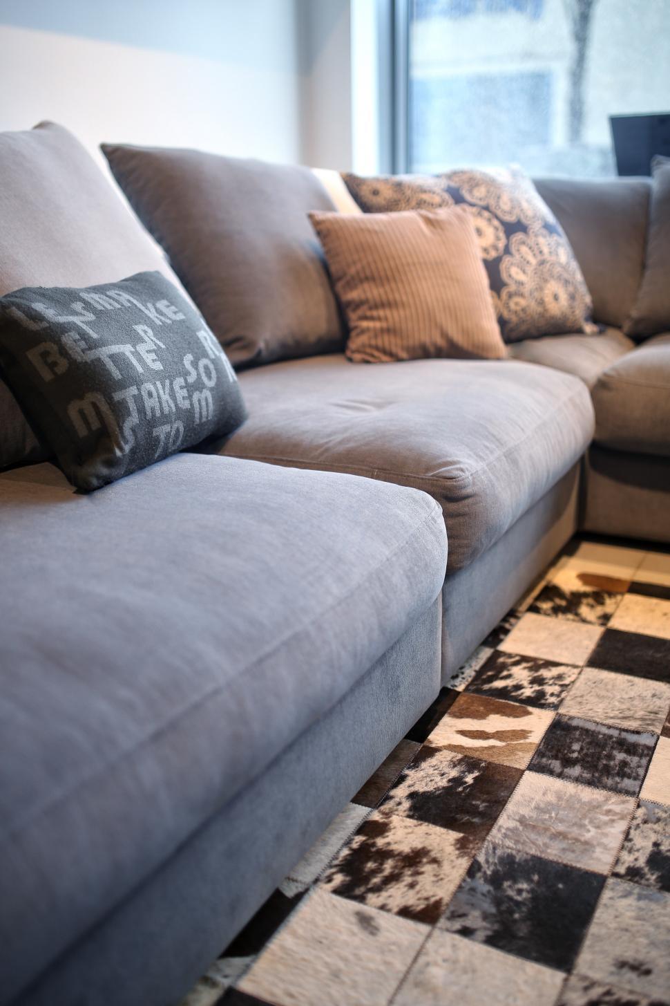 Free Image of Living Room With Couch and Checkered Rug 