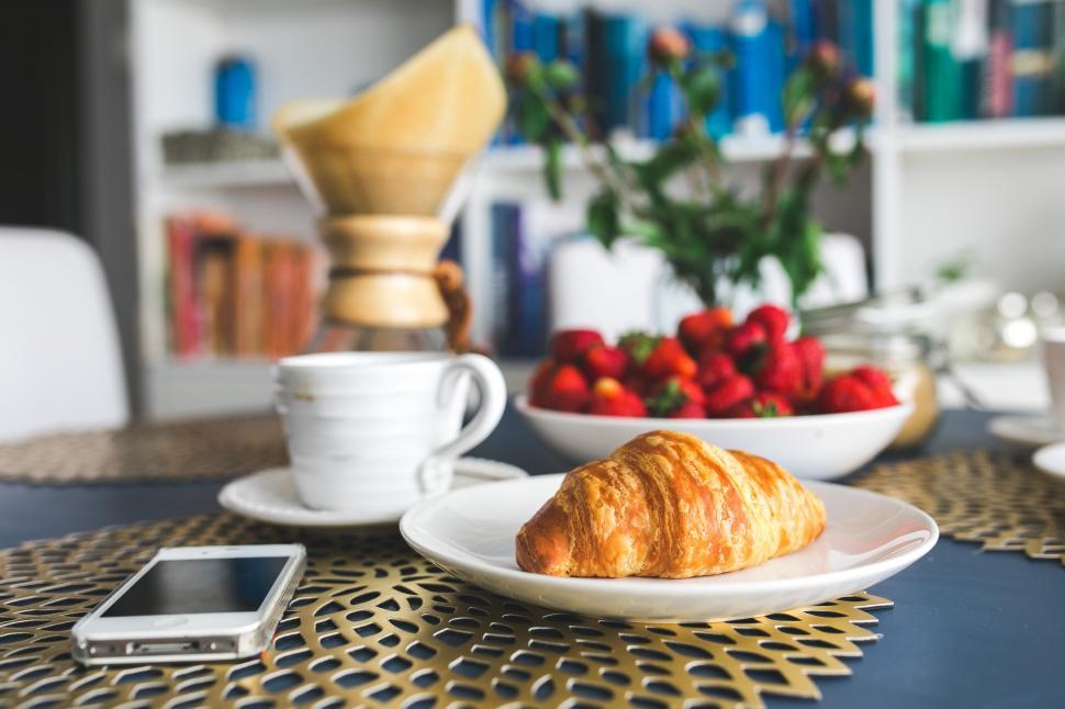 Free Image of Plate of Croissants and Bowl of Strawberries on Table 