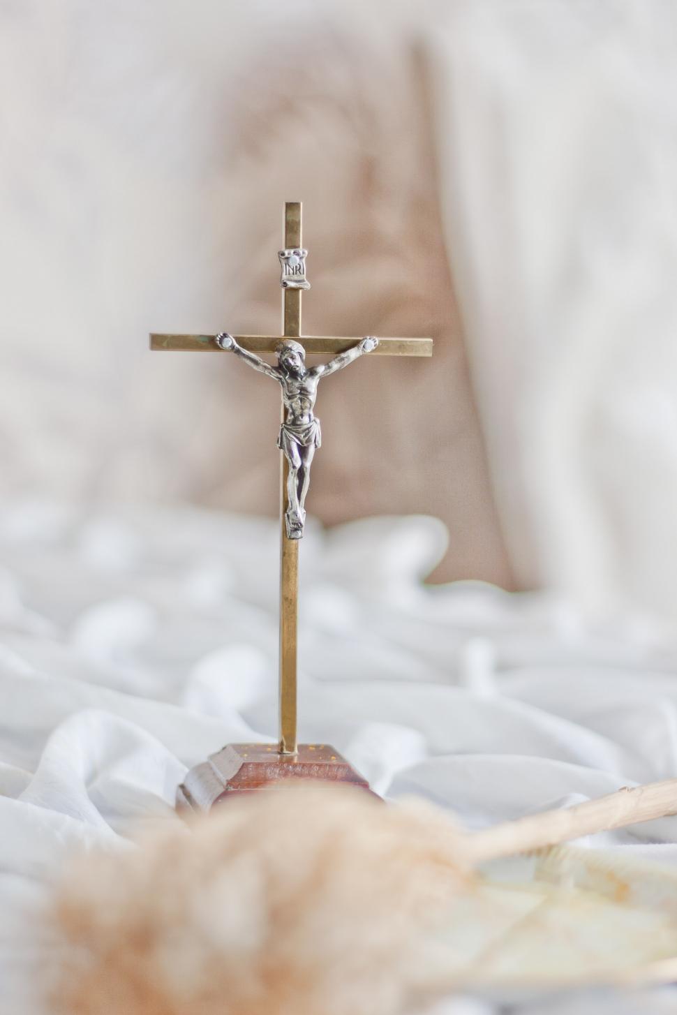 Free Image of Crucifix on a Bed in a Room 