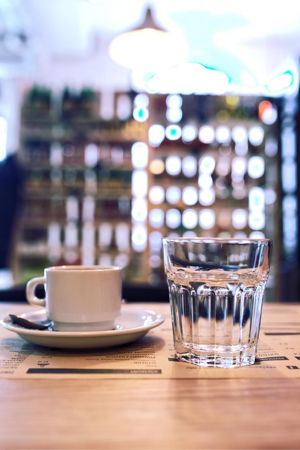 Free Image of A Glass of Water and a Plate on a Table 