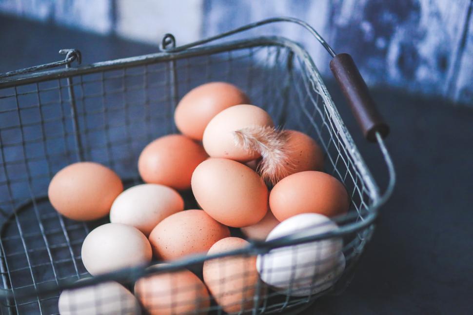 Free Image of A Basket of Eggs on a Wooden Table 