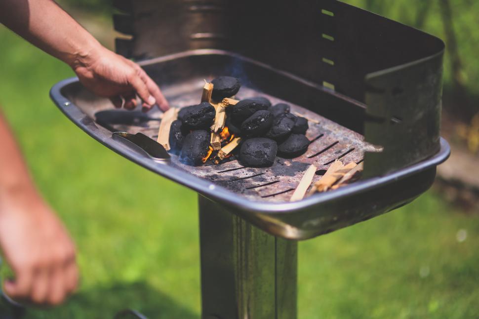 Free Image of Person Cooking Food on a Grill 