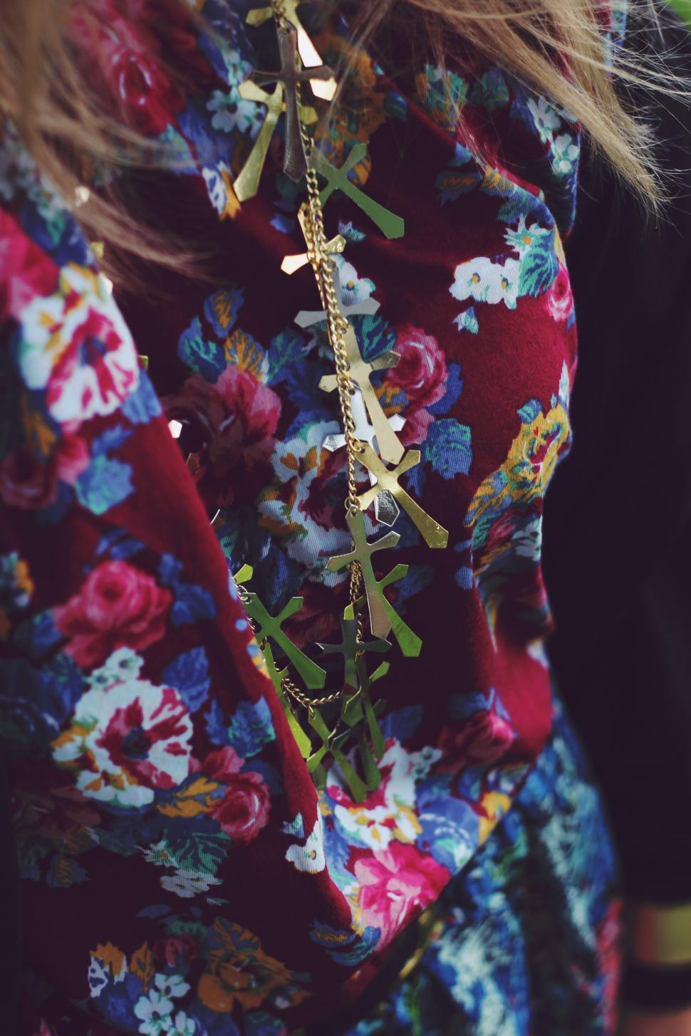 Free Image of Close Up of Person Wearing Floral Shirt 