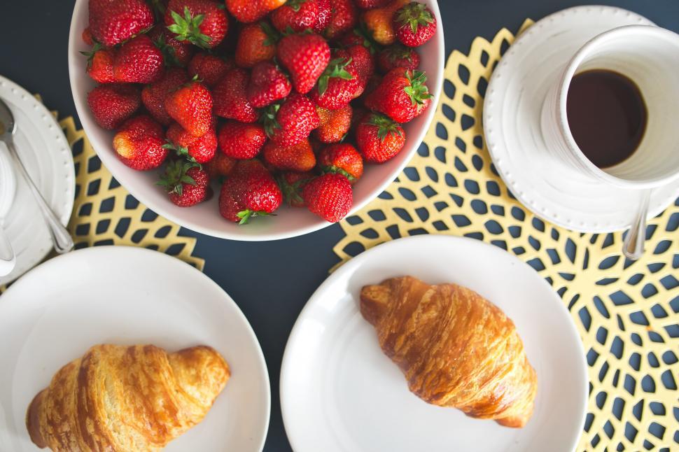 Free Image of Bowl of Strawberries and Plate of Croissants 