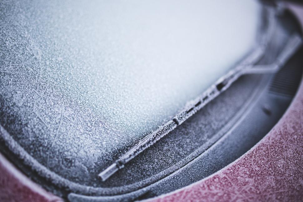 Free Image of Close Up of Car Hood Covered in Snow 