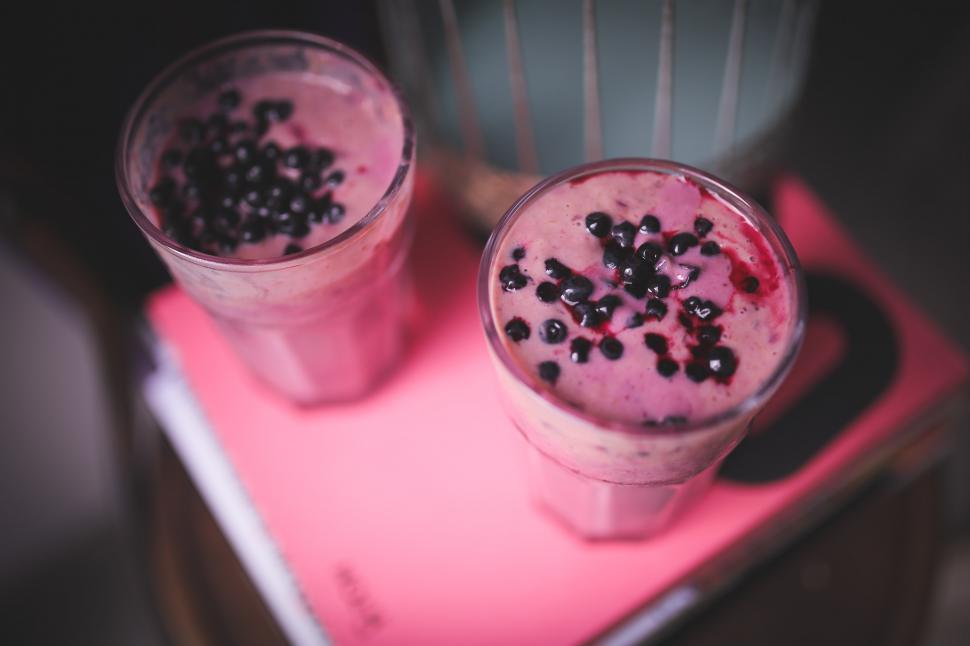 Free Image of Two Glasses of Milkshakes With Sprinkles on a Tray 