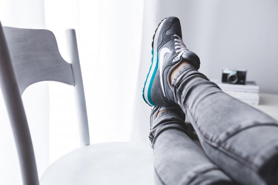 Free Image of Person Sitting on Chair With Feet Up 
