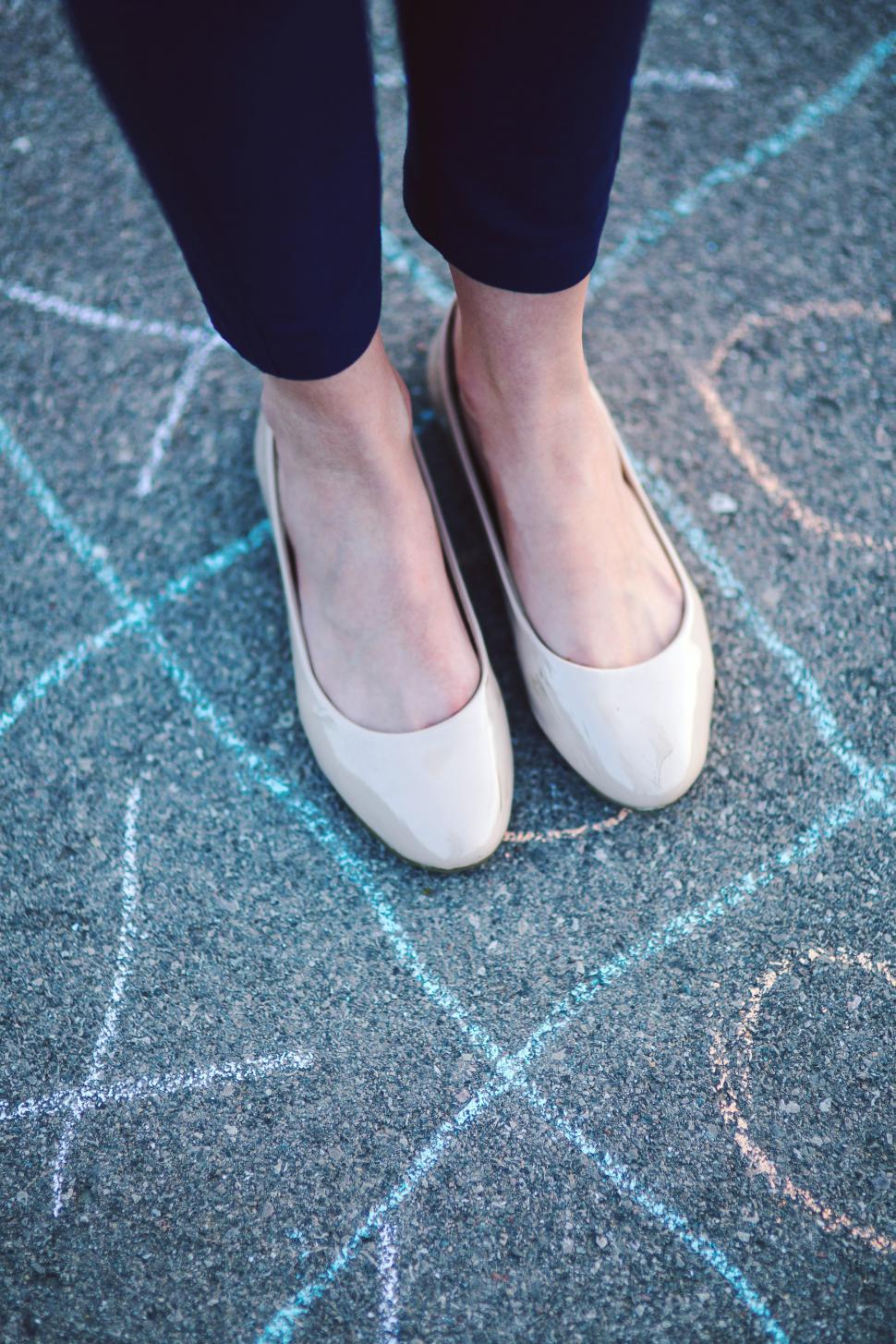 Free Image of Close Up of Person Wearing White Shoes 