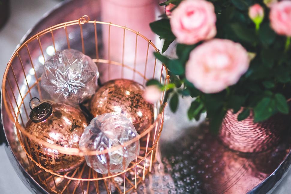 Free Image of A Basket of Christmas Ornaments on a Table 