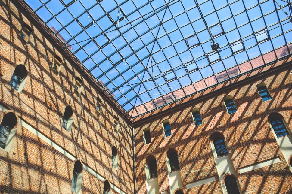 Free Image of Brick Building With Glass Roof and Windows 