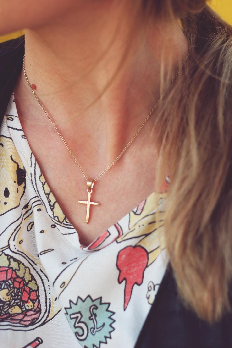 Free Image of Woman Wearing a Cross Necklace 