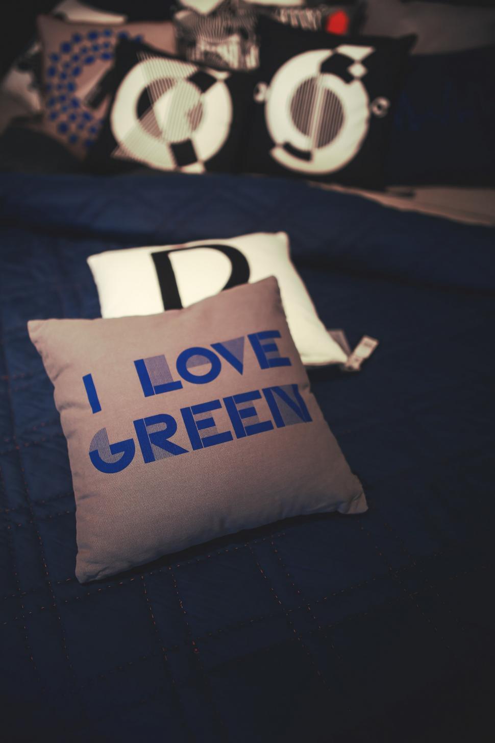 Free Image of Bed With Two Pillows and I Love Green Pillow 