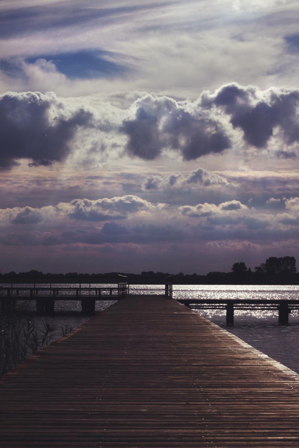 Free Image of Long Dock With a Few Clouds in the Sky 