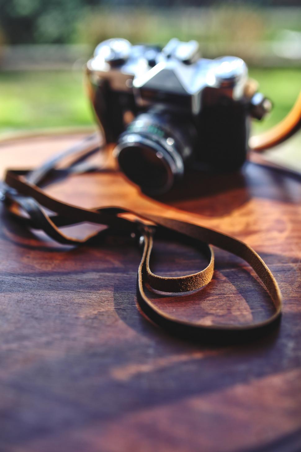 Free Image of Camera on Wooden Table 
