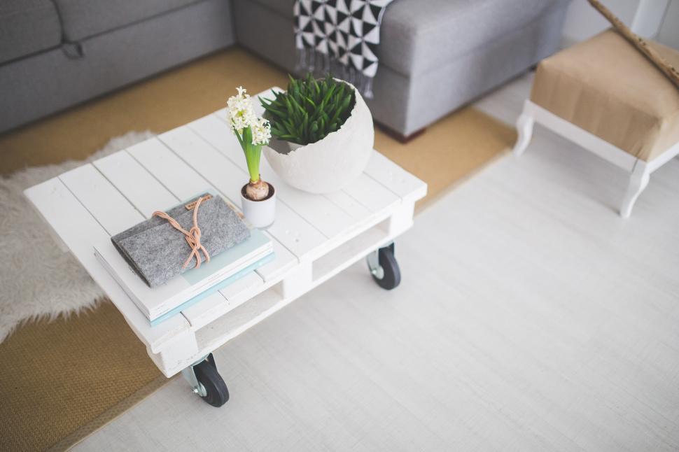 Free Image of White Coffee Table With Plant 