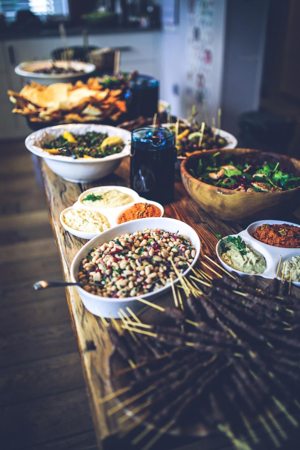 Free Image of Wooden Table With Bowls of Food 