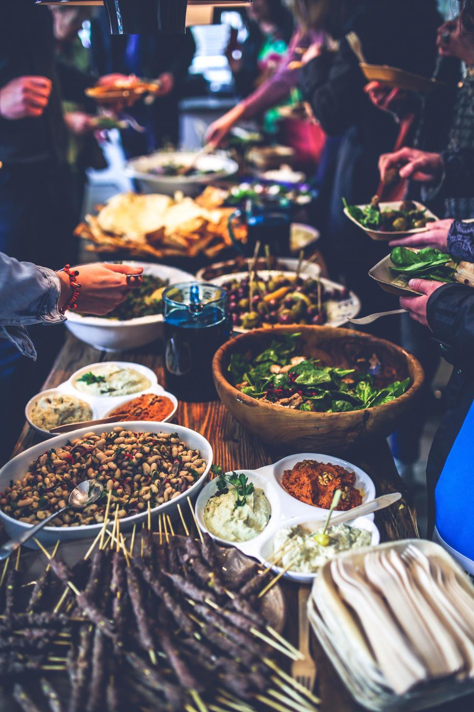 Free Image of Long Table Overflowing With Food 