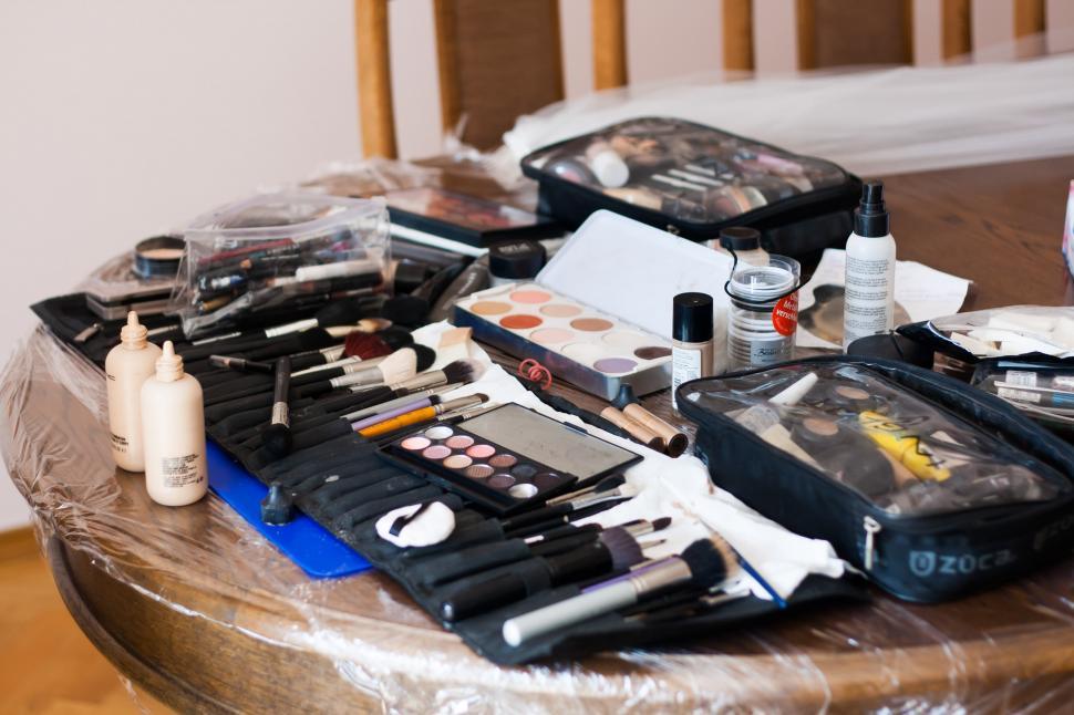 Free Image of Table Laden With Makeup and Accessories 
