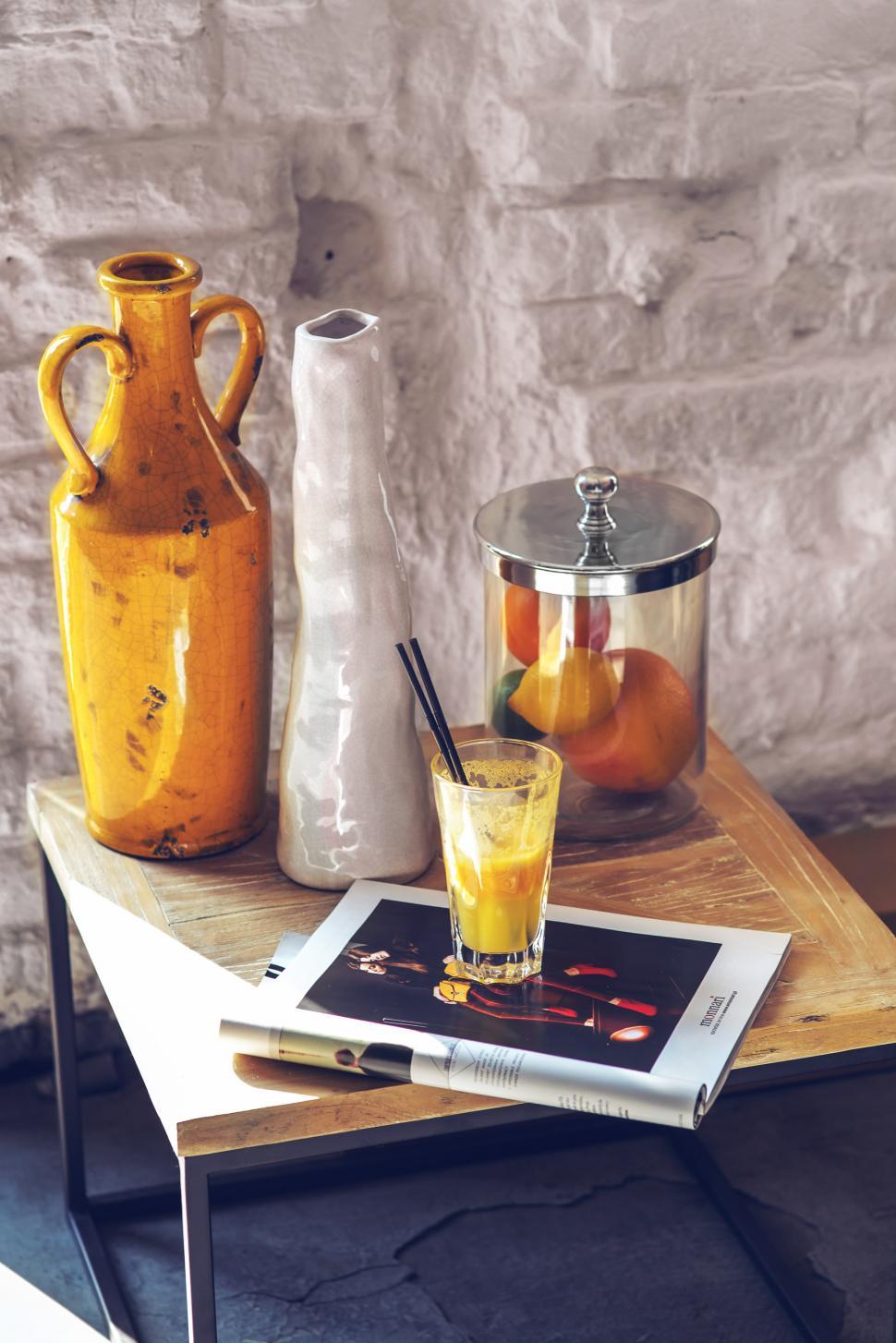 Free Image of Wooden Table With Glass of Orange Juice 