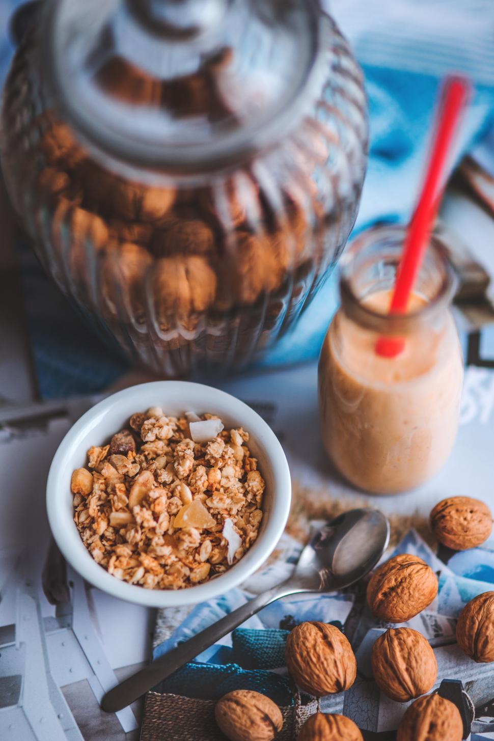 Free Image of Bowl of Nuts and Jar of Peanut Butter 