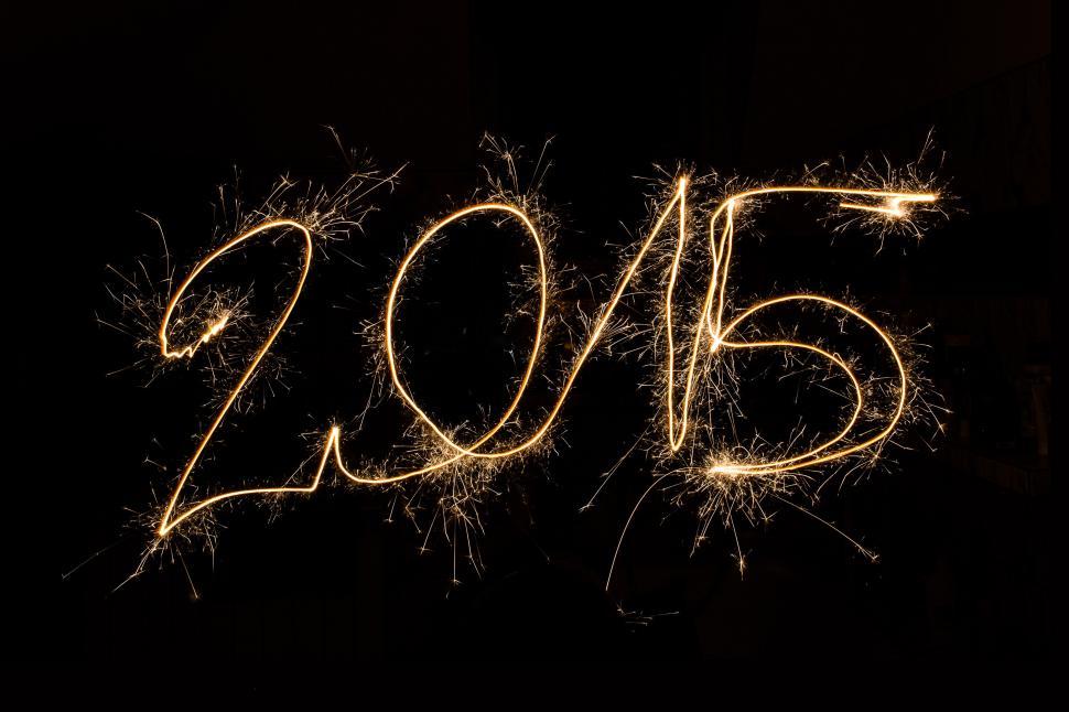 Free Image of New Years Eve Celebration With Sparklers Shaped Like Numbers 