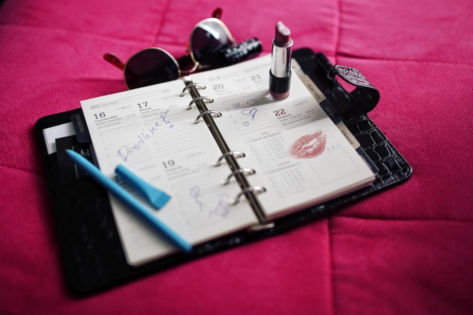Free Image of Book calendar female kiss lips lipstick organizer planner schedule women mousetrap trap device 
