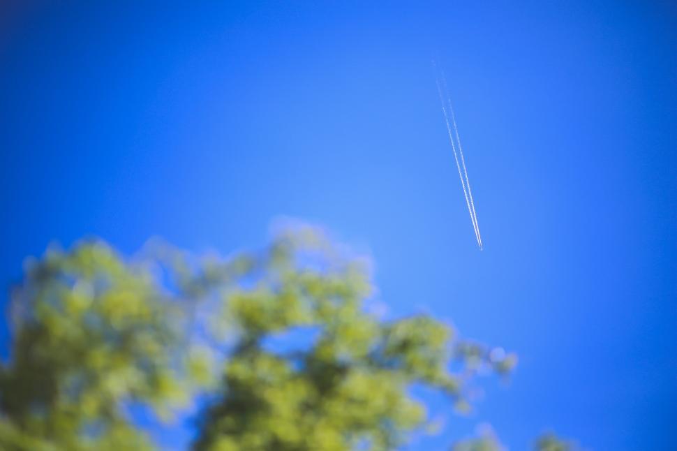Free Image of A Plane Flying in the Blue Sky 
