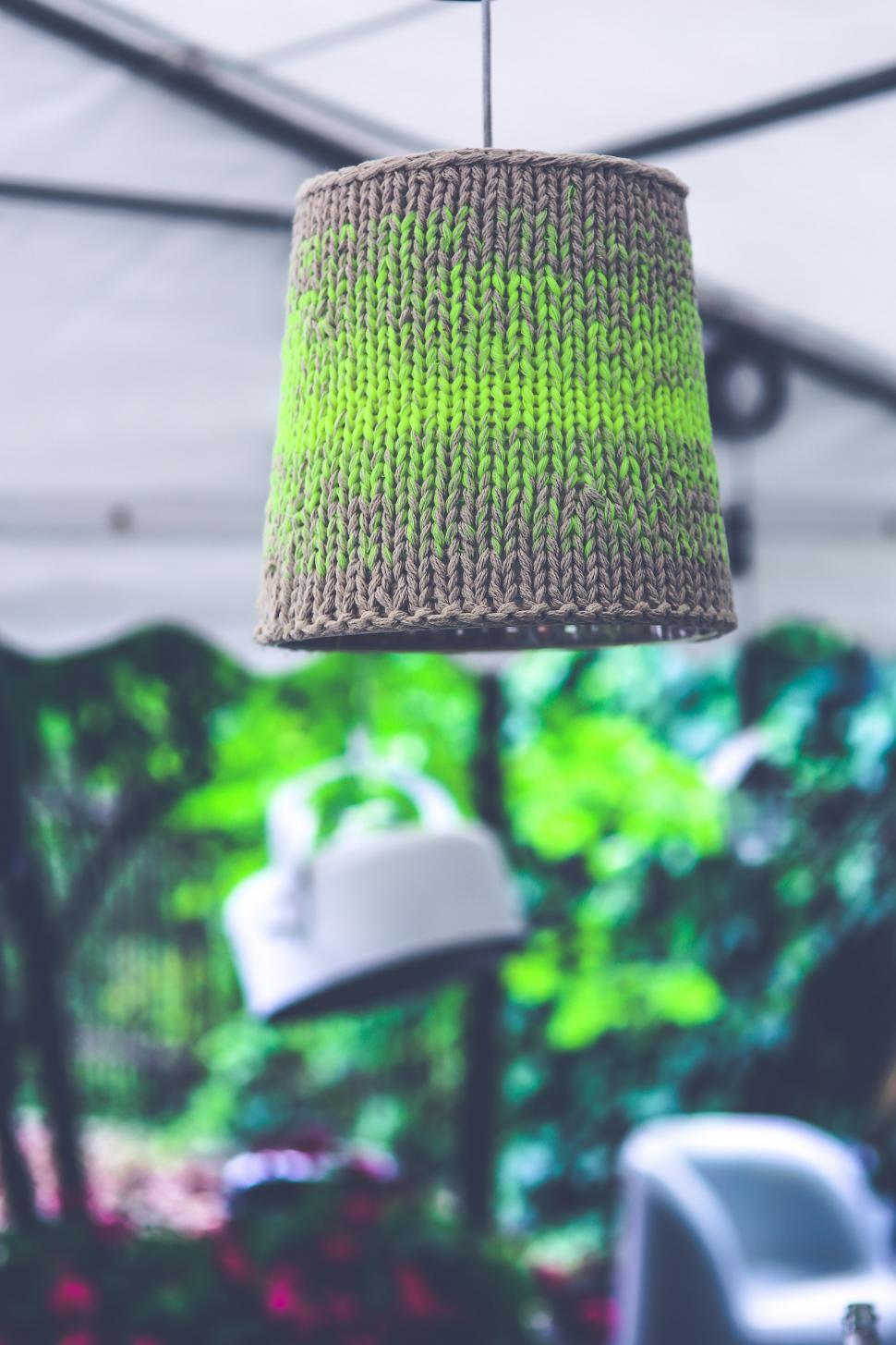 Free Image of Green Knitted Lamp Hanging From Ceiling 