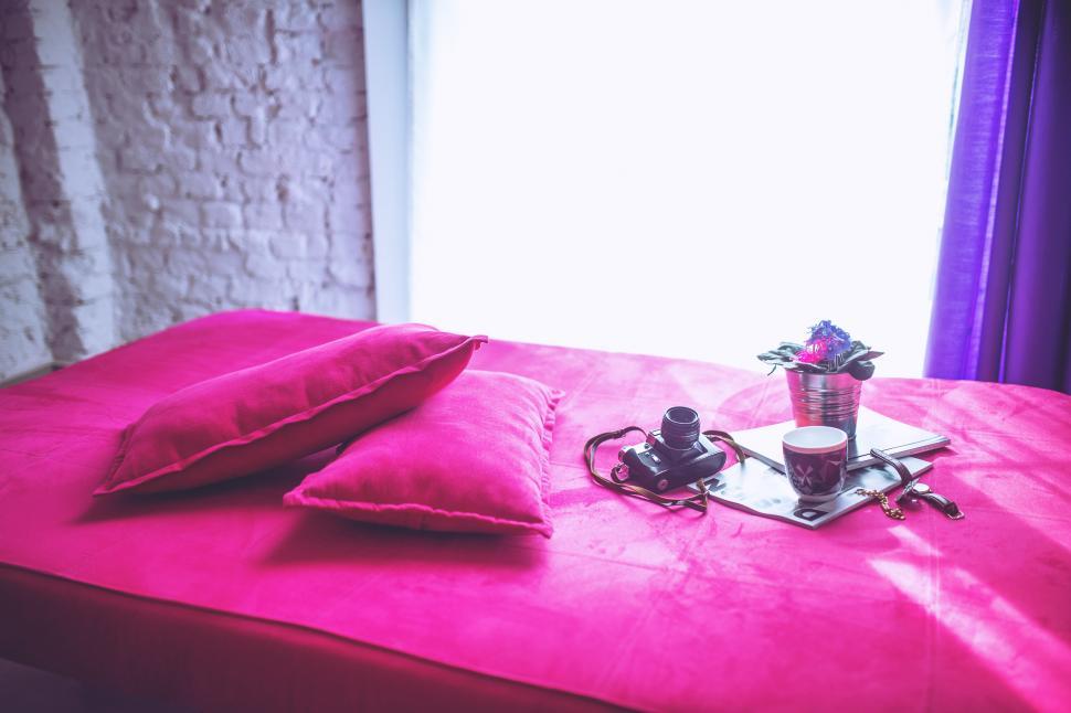 Free Image of Elegant Bed With Red Comforter and Pillows 