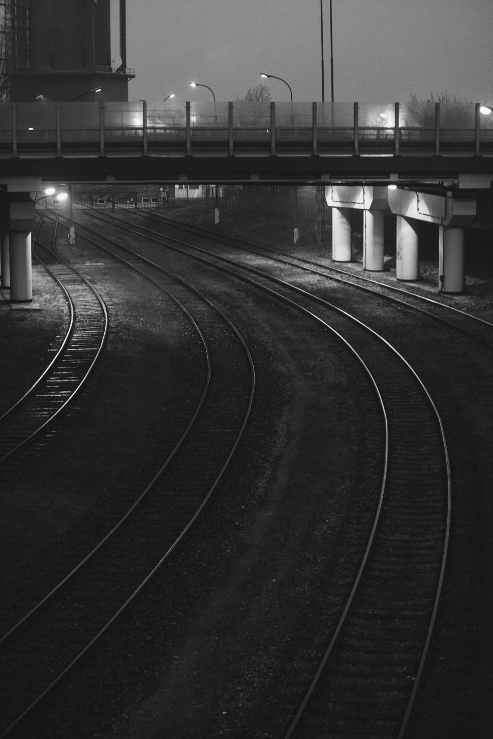 Free Image of A Black and White Photo of a Train Track 