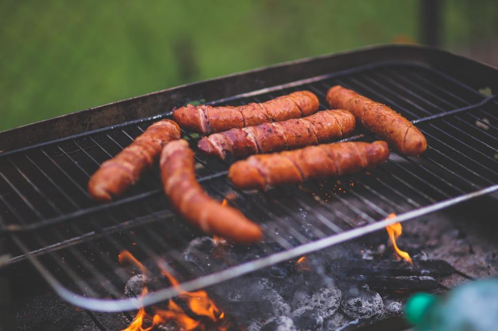 Free Image of Hot Dogs Cooking on a Grill 
