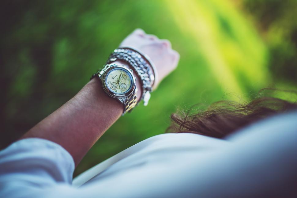 Free Image of Woman Checking Time With Wristwatch 