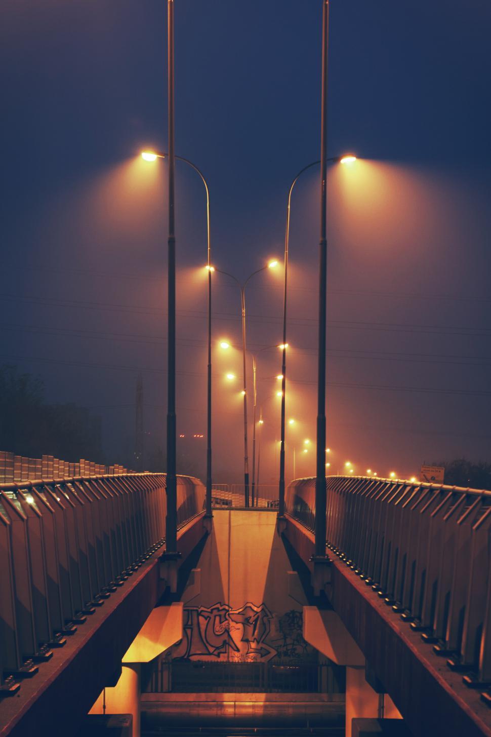 Free Image of Long Bridge With Street Lights on a Foggy Night 