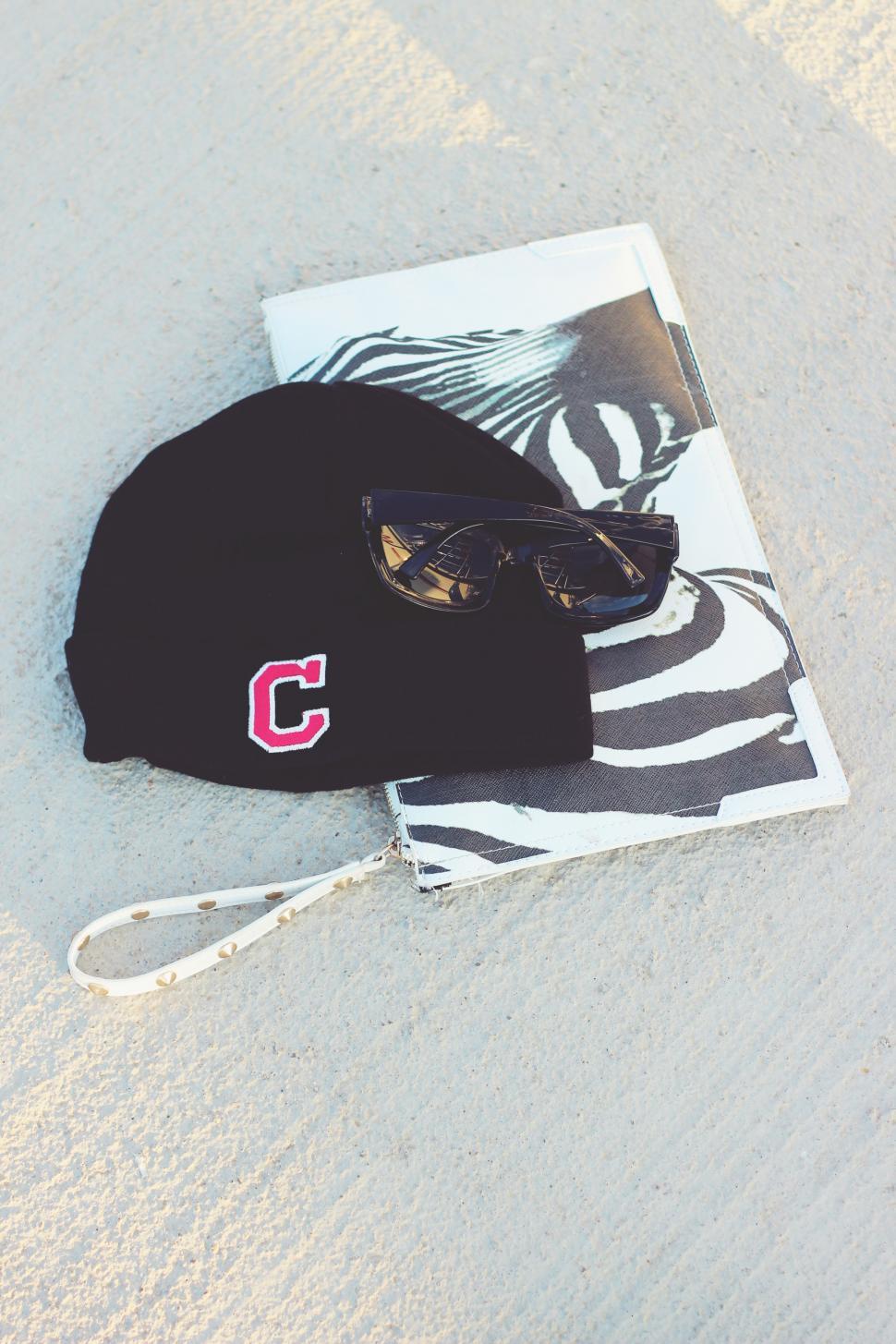 Free Image of Hat and Sunglasses on Beach Towel 