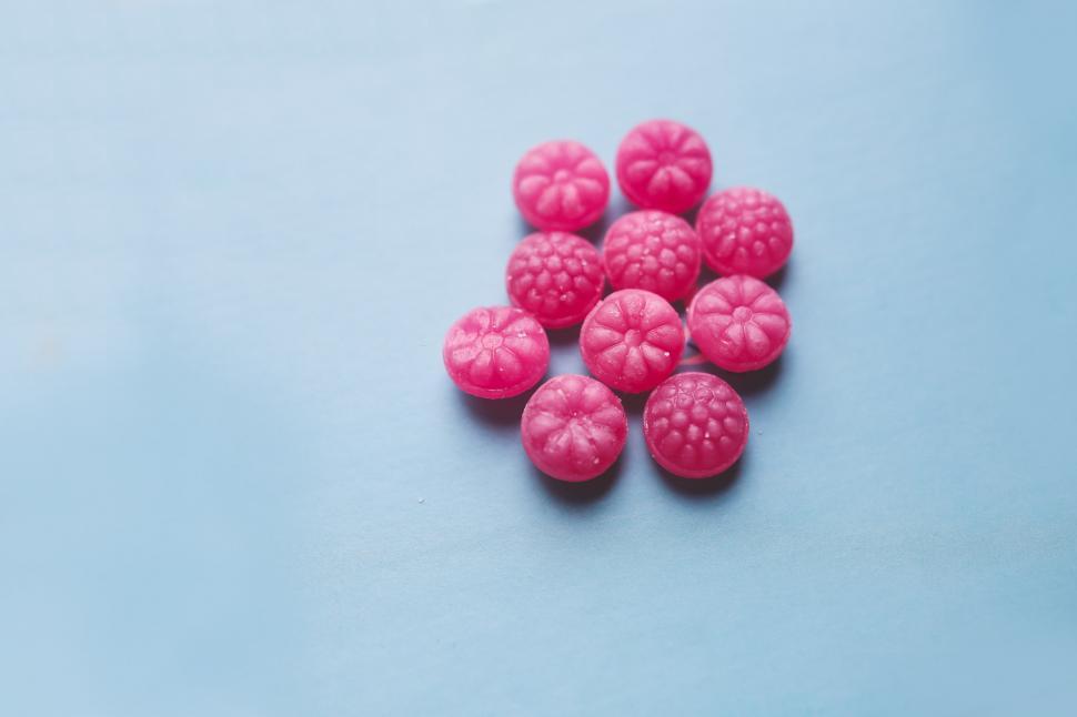 Free Image of Group of Raspberries on Blue Surface 