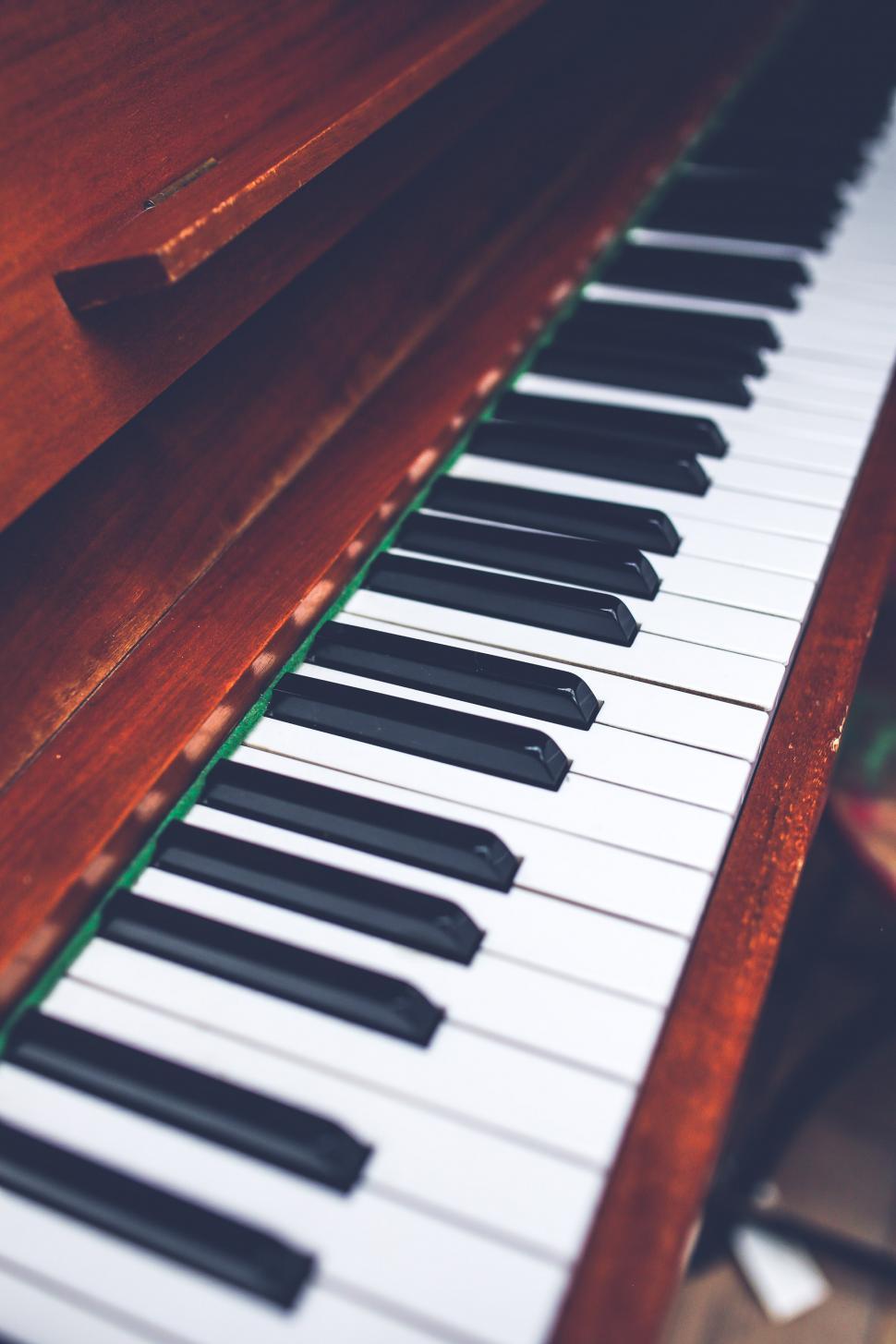 Free Image of Close-Up of Piano With Wooden Case 