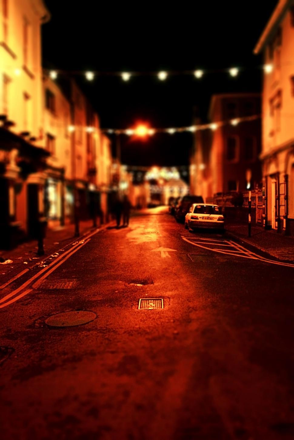 Free Image of City Street at Night With Parked Cars 