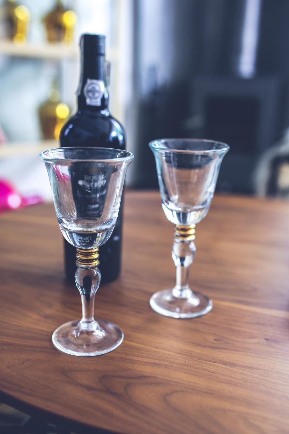 Free Image of Two Wine Glasses and Bottle on Table 