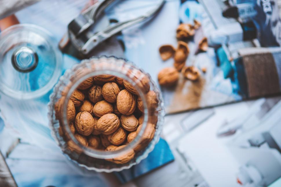 Free Image of Glass Bowl Filled With Nuts on Table 