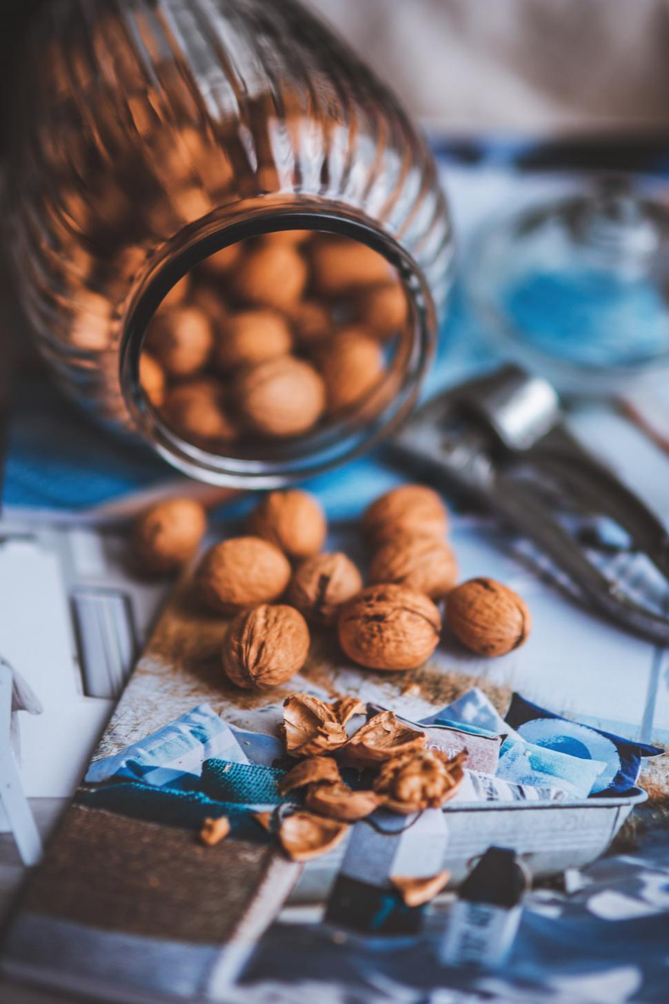Free Image of Glass Jar Filled With Nuts on Table 
