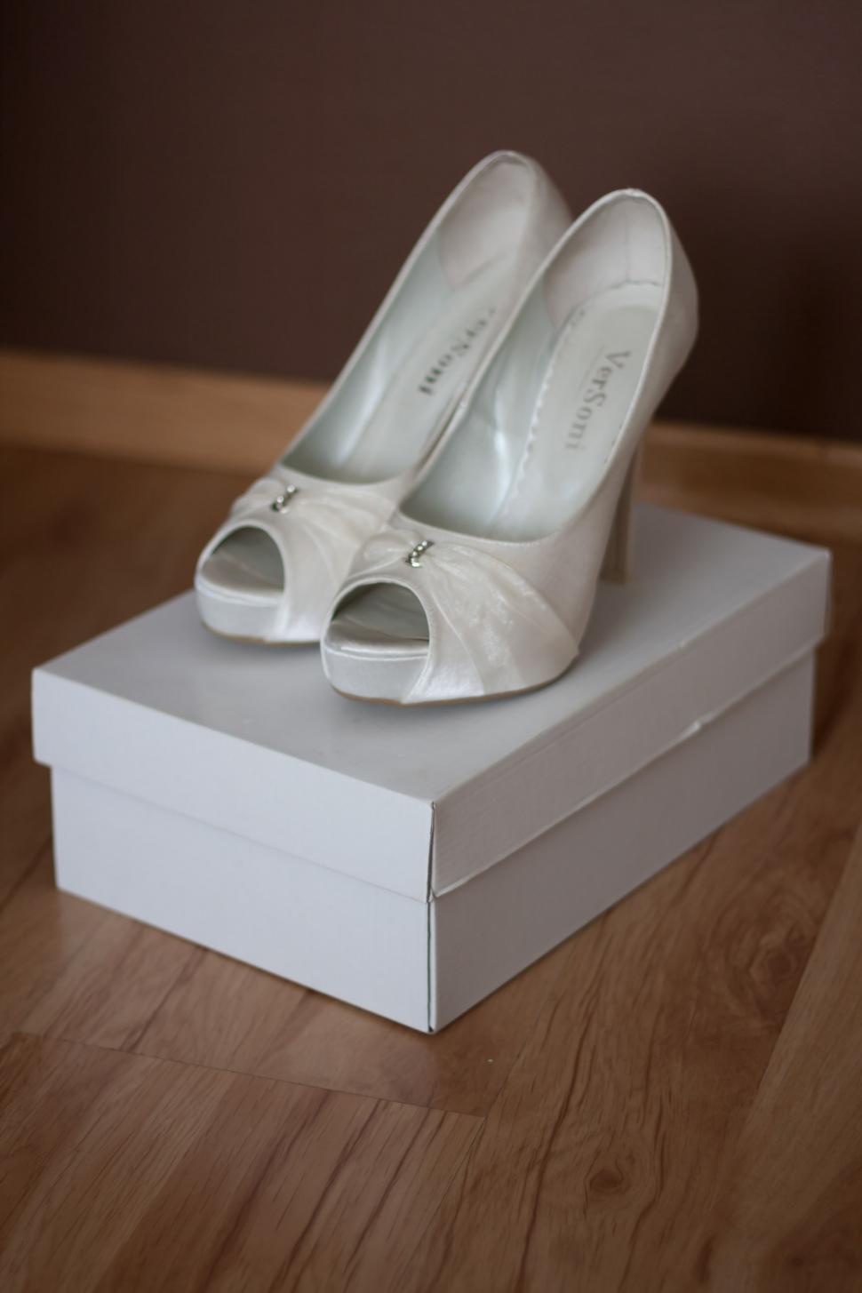 Free Image of White High Heels on Top of a Box 