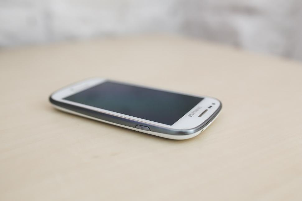 Free Image of Close Up of Cell Phone on Table 