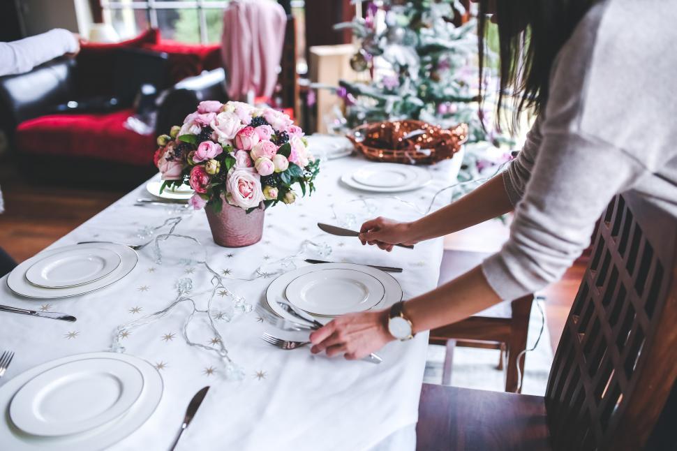 Free Image of Woman Setting the Table for a Meal 