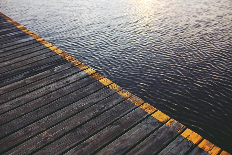 Free Image of Wooden Dock With Water and Yellow Line 