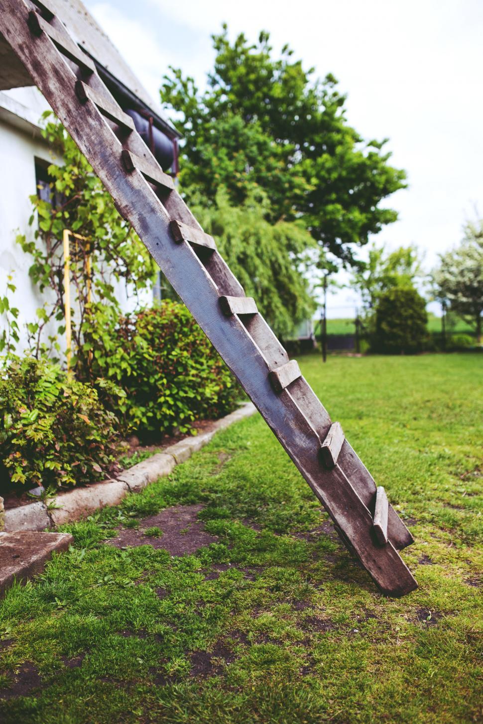 Free Image of Wooden Ladder Leaning Against House 