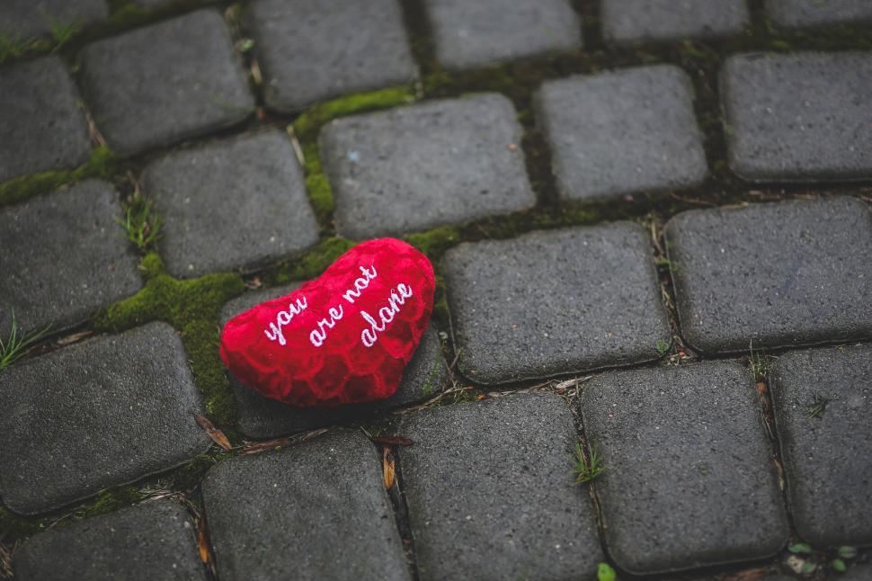 Free Image of Red Heart on Cobblestone Road 