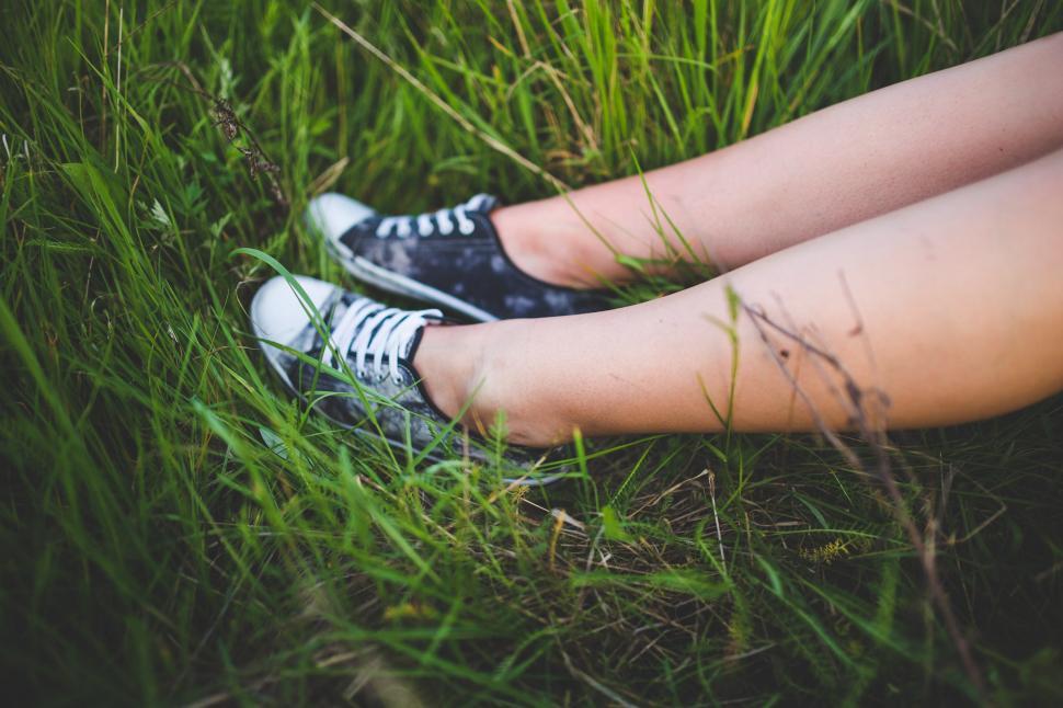Free Image of Person Sitting in Grass With Crossed Legs 